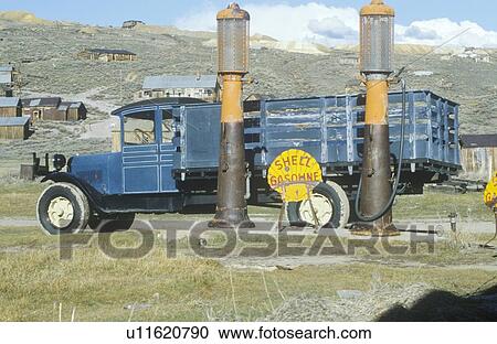 Stock Image - Antique delivery truck and gasoline pumps at Bodie, a CA ghost town. Fotosearch