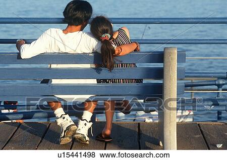 Asian couple on bench at Santa Monica Pier, California View Large Photo Image Stock Photo - Asian couple on bench at Santa Monica Pier, California. Fotosearch