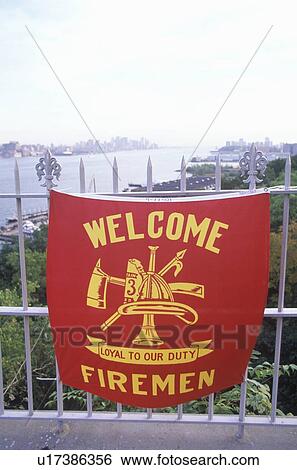 Stock Photograph - Banner for fire fighters in memory of September 11, New York. Fotosearch