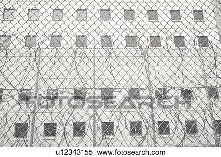 Stock Photography - Barbed wire at prison. Fotosearch