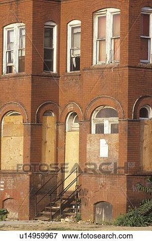 Stock Photo - Boarded up abandoned brick building. Fotosearch