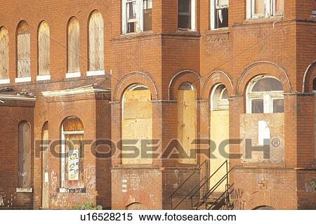 Boarded up abandoned brick building View Large Photo Image Stock Photography - Boarded up abandoned brick building. Fotosearch