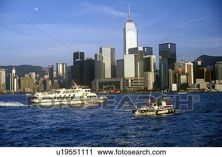Stock Image - Boat and ship in Hong Kong Harbor. Fotosearch