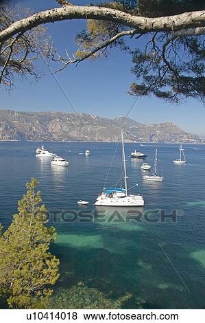 Stock Photo - Boats docked near Patoma Beach. Fotosearch