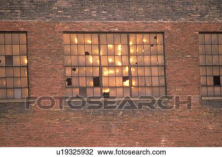 Broken windows of an abandoned brick factory building View Large Photo Image Stock Image - Broken windows of an abandoned brick factory building. Fotosearch