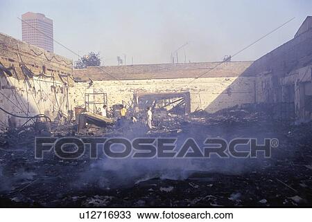 Stock Image - Burned out business after riots in South Central Los Angeles, California. Fotosearch