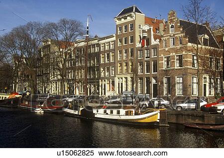 Canals and houseboats in Amsterdam, Holland View Large Photo Image Stock Photography - Canals and houseboats in Amsterdam, Holland. Fotosearch