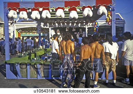 Carny game on Santa Monica pier with tourist View Large Photo Image Stock Image - Carny game on Santa Monica pier with tourist. Fotosearch