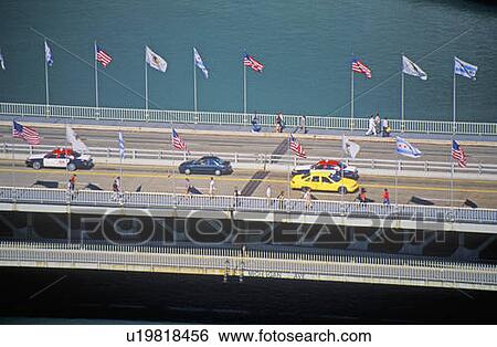 Cars and pedestrians cross over the Chicago River View Large Photo Image Stock Photograph - Cars and pedestrians cross over the Chicago River. Fotosearch