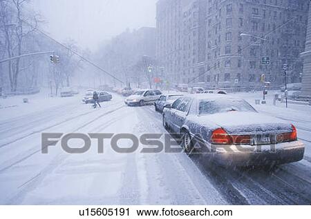 Stock Image - Cars in winter storm. Fotosearch