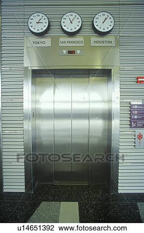 Chrome elevator doors & world time zones View Large Photo Image Stock Image - Chrome elevator doors & world time zones. Fotosearch