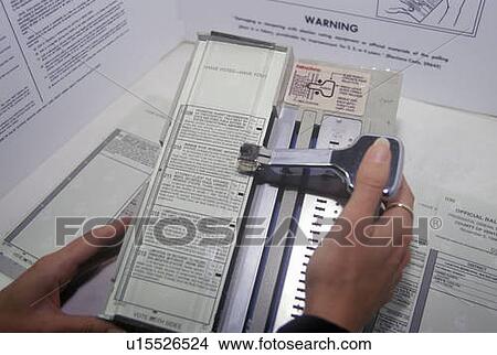 Close-up of a voting booth and ballot machine with ballot View Large Photo Image Picture - Close-up of a voting booth and ballot machine with ballot. Fotosearch