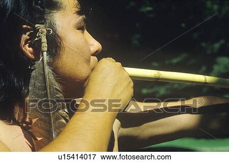 Close-up of Cherokee using a blow gun View Large Photo Image Stock Photo - Close-up of Cherokee using a blow gun. Fotosearch