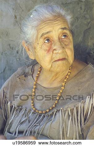 Stock Photo - Close-up of elderly Native American woman wearing necklace. Fotosearch