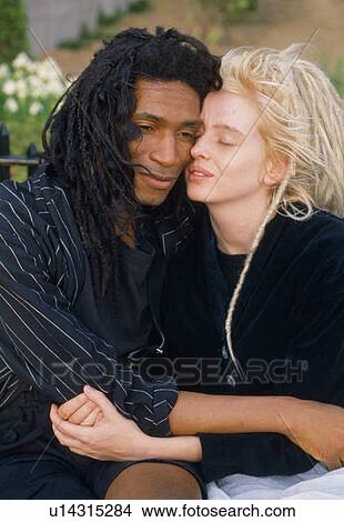 Picture - Close-up of multi-cultural couple wearing dreadlocks. Fotosearch