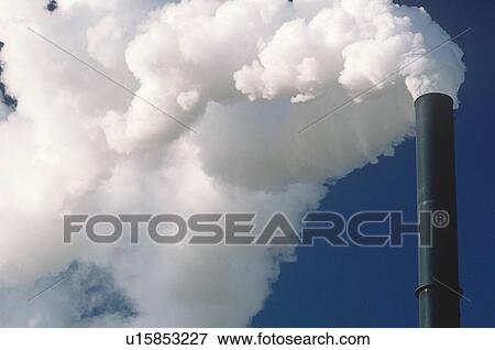 Close-up of smoking smokestack View Large Photo Image Stock Photo - Close-up of smoking smokestack. Fotosearch