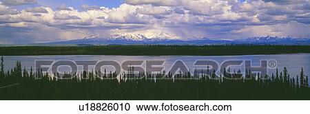 Cloud shrouded mountains in Wrangell-St. Elias National Part, Alaska View Large Photo Image Stock Image - Cloud shrouded mountains in Wrangell-St. Elias National Part, Alaska. Fotosearch