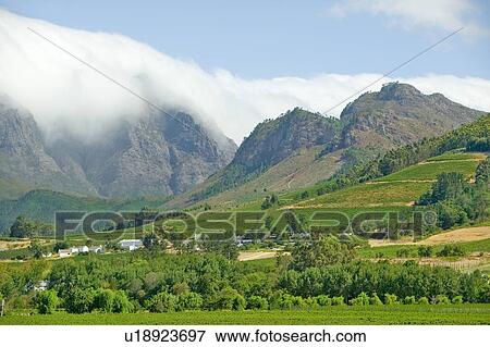 Stock Photo - Clouds cover mountains. Fotosearch
