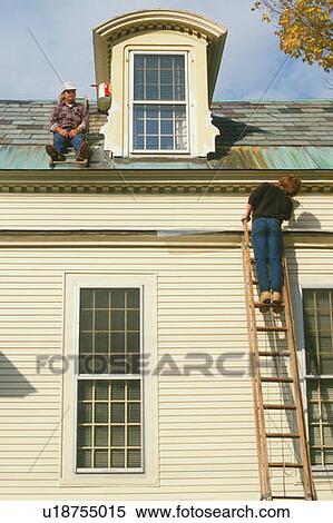 Couple painting house View Large Photo Image Stock Photography - Couple painting house. Fotosearch