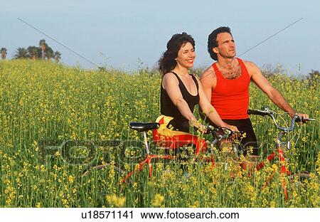 Couple resting during bicycle ride View Large Photo Image Stock Image - Couple resting during bicycle ride. Fotosearch