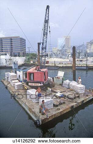 Stock Image - Crane and small barge, Miami Harbor, Miami, Florida. Fotosearch