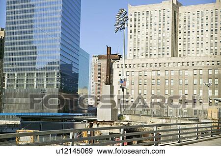 Stock Photo - Cross at World Trade Towers Memorial Site for September 11, 2001, New York City, NY. Fotosearch