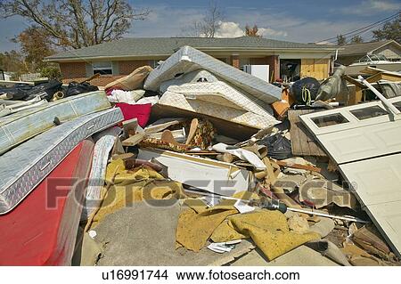 Debris in front of house heavily hit by Hurricane Ivan in Pensacola Florida View Large Photo Image Picture - Debris in front of house heavily hit by Hurricane Ivan in Pensacola Florida. Fotosearch