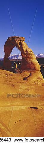 Stock Image - Delicate Arch & La Sal Mountains, Arches National Park, Moab, Utah. Fotosearch