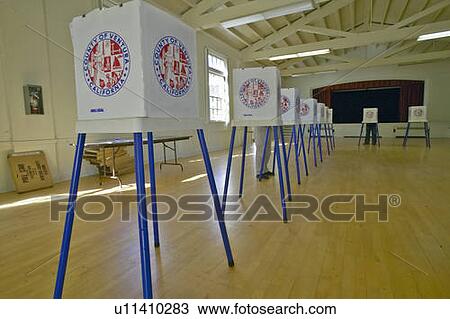 Election volunteers and voting booths in a polling place View Large Photo Image Stock Image - Election volunteers and voting booths in a polling place. Fotosearch