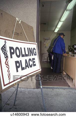 Election volunteers assisting voters in a polling place View Large Photo Image Stock Image - Election volunteers assisting voters in a polling place. Fotosearch