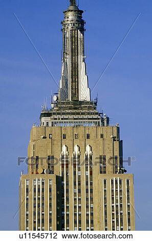 Stock Image - Empire State Building at sunrise, New York City, NY. Fotosearch