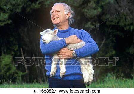Stock Photo - Farmer and lamb. Fotosearch