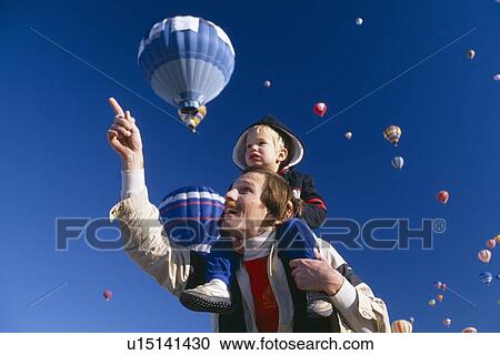 Father with young son on his shoulders at Hot Air Balloon Festival View Large Photo Image Stock Image - Father with young son on his shoulders at Hot Air Balloon Festival. Fotosearch