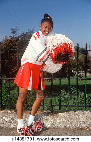 Stock Image - Female African American teenage cheerleader. Fotosearch