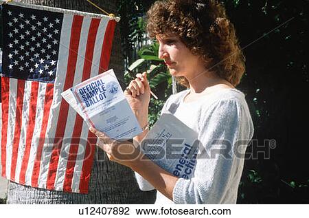 Female voter reading sample ballot at polling location View Large Photo Image Stock Image - Female voter reading sample ballot at polling location. Fotosearch