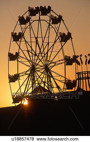 Ferris wheel silhouetted at sunset on the Santa Monica Pier in Los Angeles, CA View Large Photo Image Stock Photo - Ferris wheel silhouetted at sunset on the Santa Monica Pier in Los Angeles, CA. Fotosearch