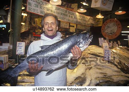 Fish seller at Salmon stand at Pike Place Public Farmers Market, Seattle, WA View Large Photo Image Stock Image - Fish seller at Salmon stand at Pike Place Public Farmers Market, Seattle, WA. Fotosearch