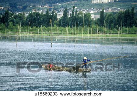 Fishing boat on Erhai Lake in Dali View Large Photo Image Stock Image - Fishing boat on Erhai Lake in Dali. Fotosearch