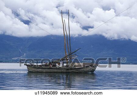 Stock Photo - Fishing boat on Erhai Lake. Fotosearch