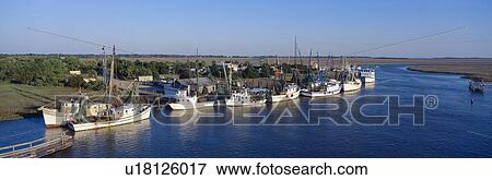 Fishing boats in Intercoastal Waterway, North Carolina View Large Photo Image Stock Photo - Fishing boats in Intercoastal Waterway, North Carolina. Fotosearch