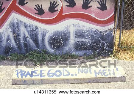 Stock Photography - Graffiti reading Praise God not men. Fotosearch