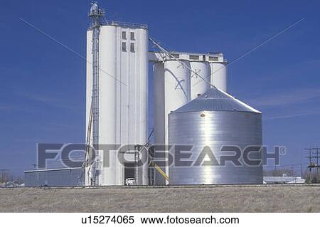 Stock Photography - Grain silo with a blue sky. Fotosearch