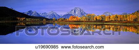 Stock Photography - Grand Tetons and reflection in Grand Teton National Park, Wyoming. Fotosearch