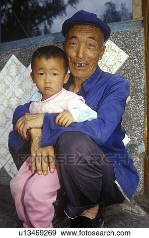 Grandfather dotes on grandson in Dali, Yunnan Province, People's Republic of China View Large Photo Image Stock Photo - Grandfather dotes on grandson in Dali, Yunnan Province, People's Republic of China. Fotosearch