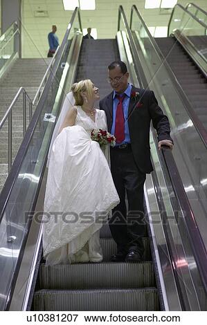 Stock Photo - Groom and Bride in airport. Fotosearch