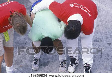 Picture - Group of runners stretching during Marathon. Fotosearch