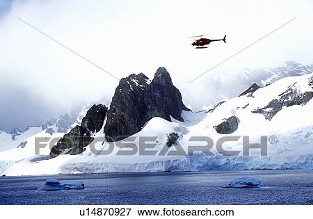 Helicopter patrolling over glaciers and icebergs in Errera Channel at Culberville Island, Antarctica View Large Photo Image Stock Photo - Helicopter patrolling over glaciers and icebergs in Errera Channel at Culberville Island, Antarctica. Fotosearch