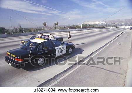 Picture - Highway Patrol on earthquake damaged freeway. Fotosearch