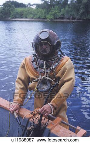 Stock Photo - Historic Greek sponge diver in antique diving suit. Fotosearch