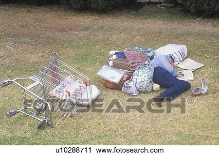 Homeless woman sleeping in a park View Large Photo Image Stock Image - Homeless woman sleeping in a park. Fotosearch